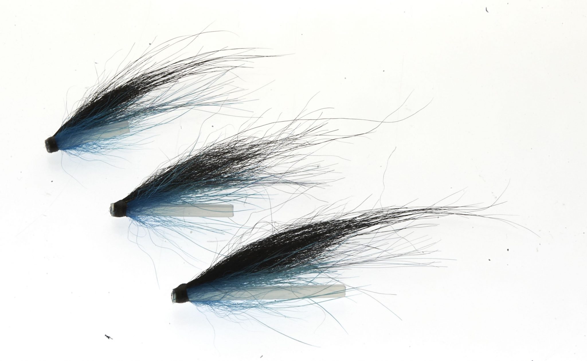 Black and blue salmon fly on tube